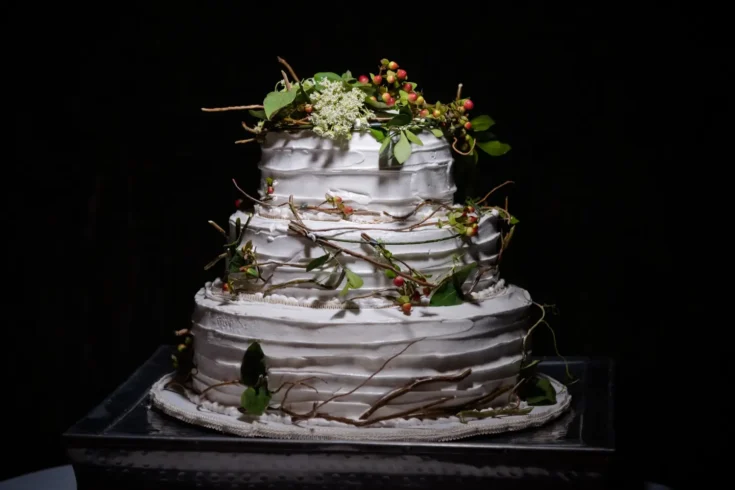 white customized wedding cake with leaves as decoration