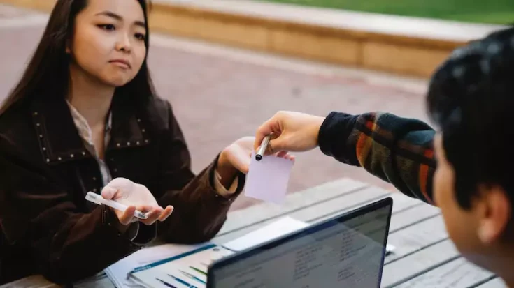 Woman and man discussing pros and cons of Afterpay and Klarna